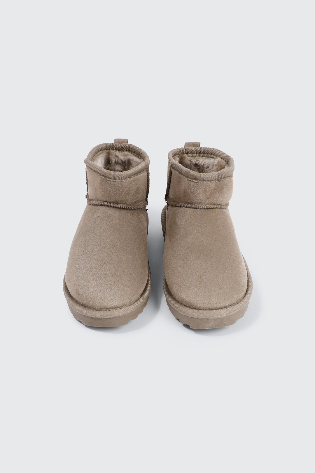 Bottes mini en faux mouton