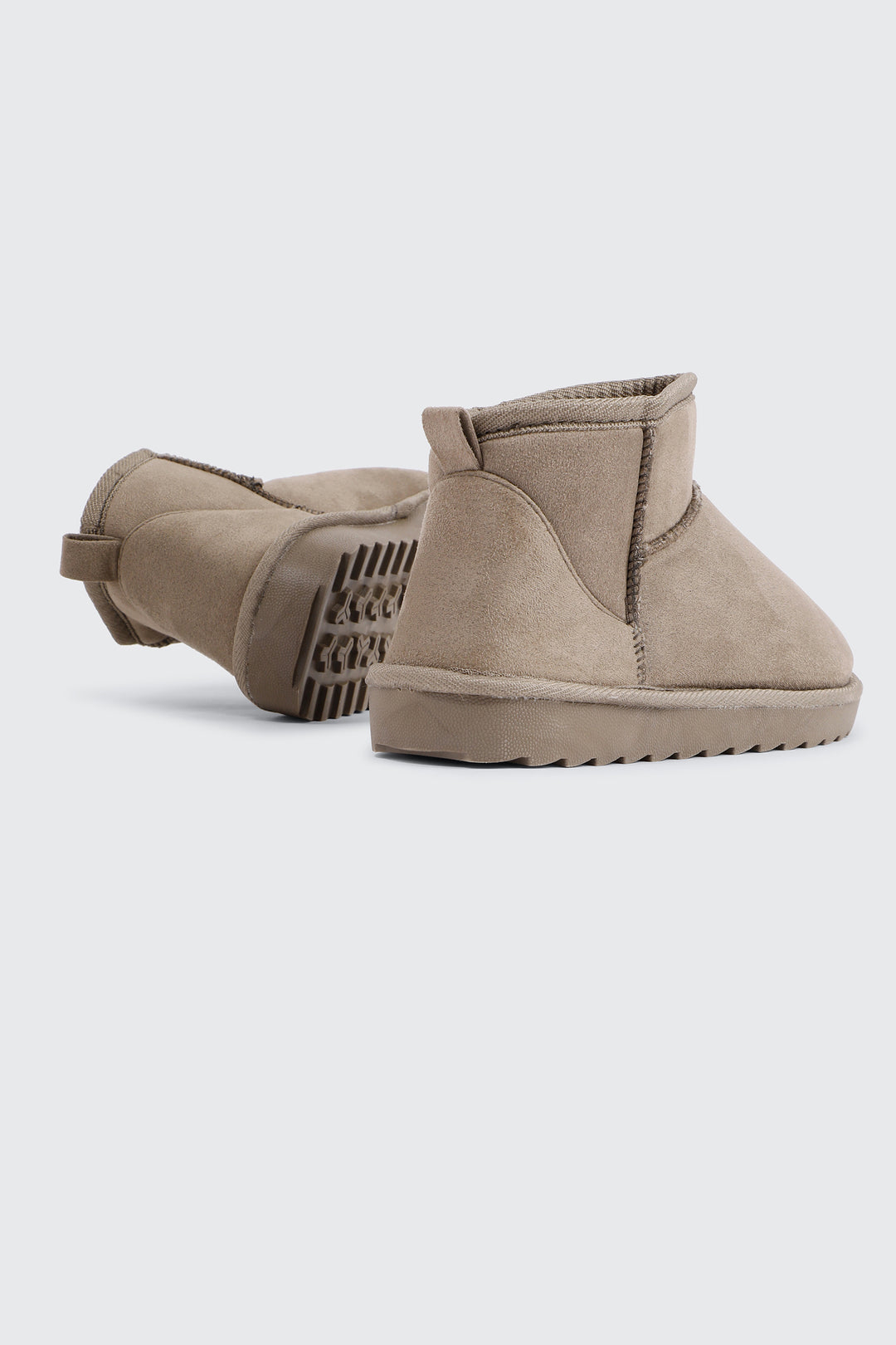 Bottes mini en faux mouton
