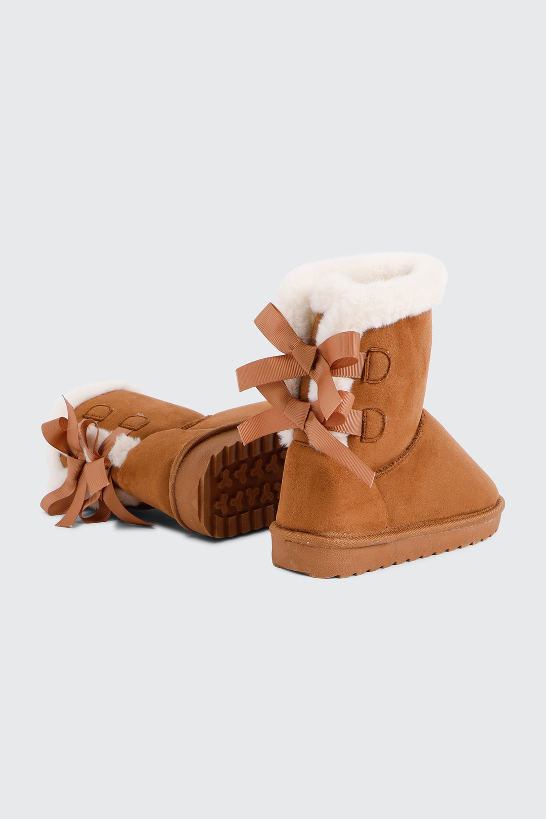 Faux Sheepskin Boots with Bow Details