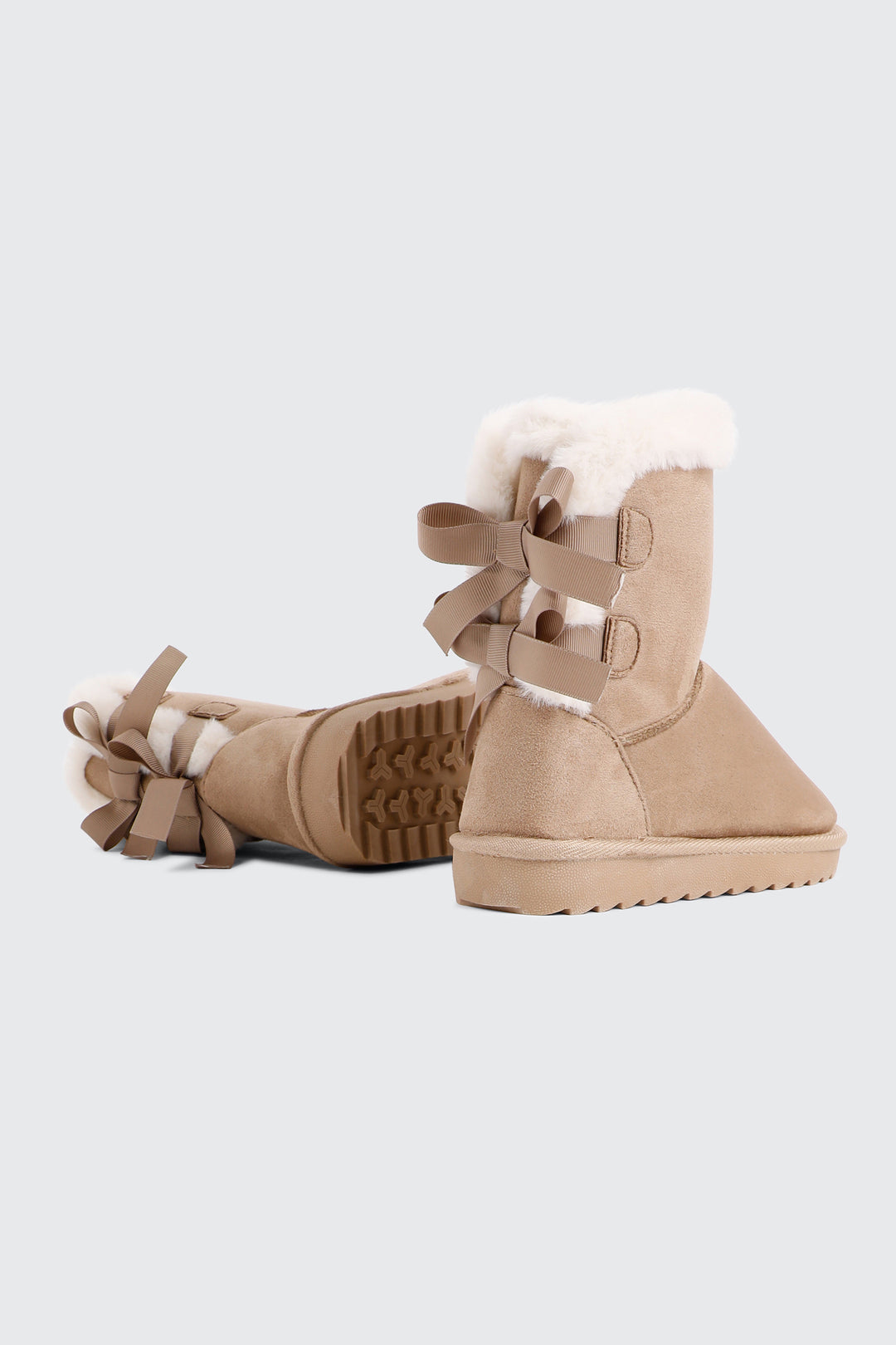 Faux Sheepskin Boots with Bow Details