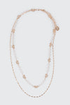 Collier à deux rang perles et boucles