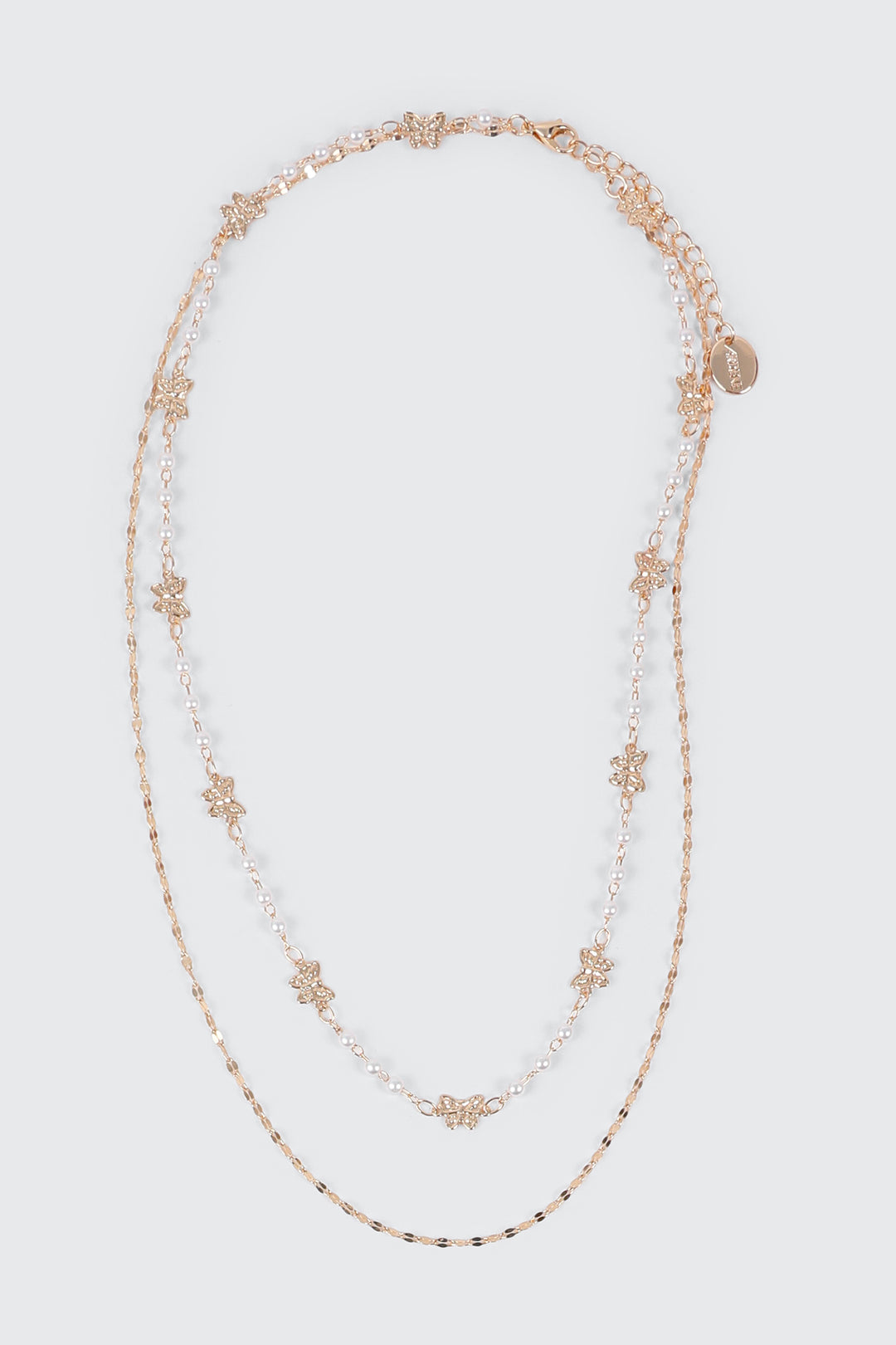 Collier à deux rang perles et boucles