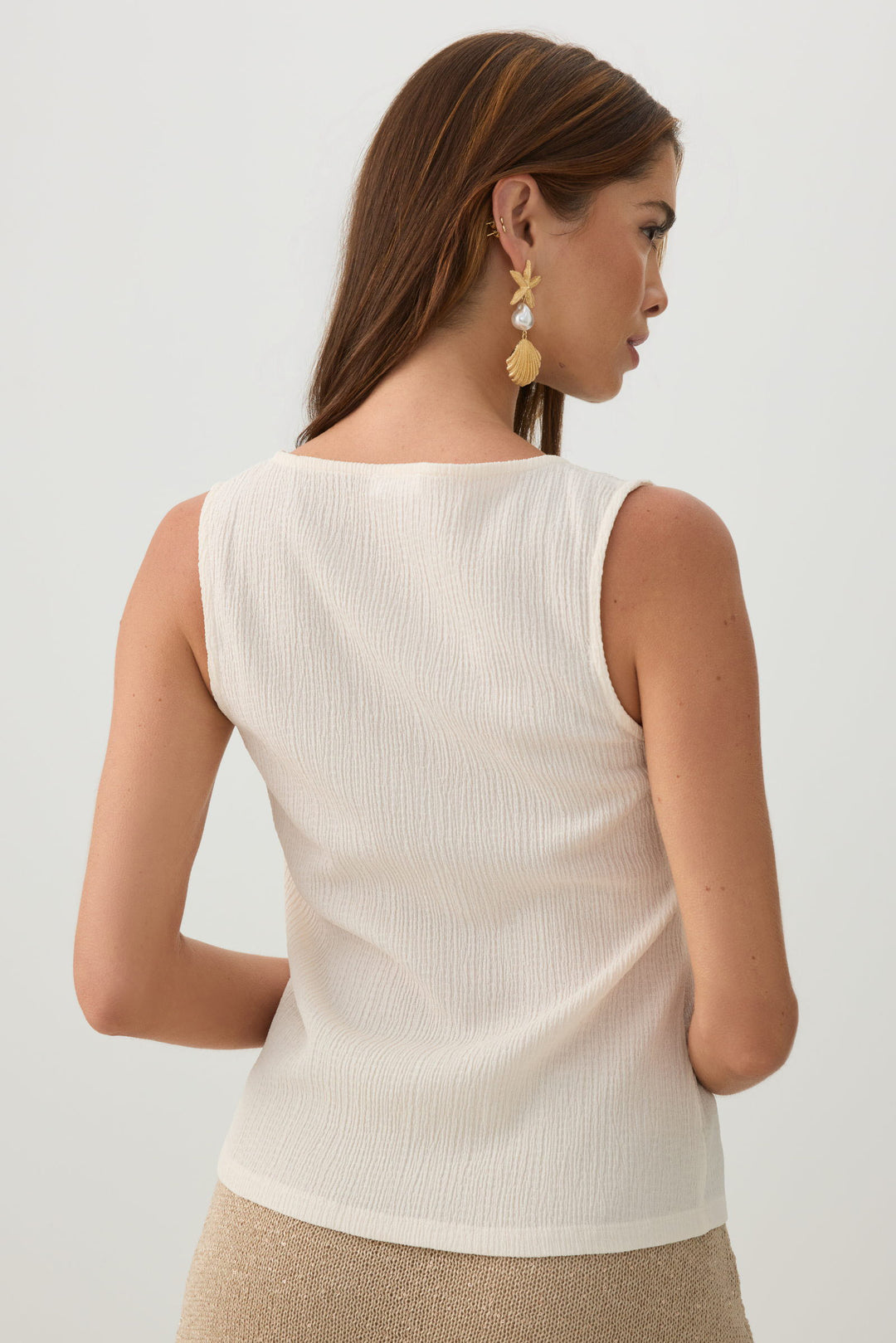 Veste sans manches boutonnée en tissu gaufré