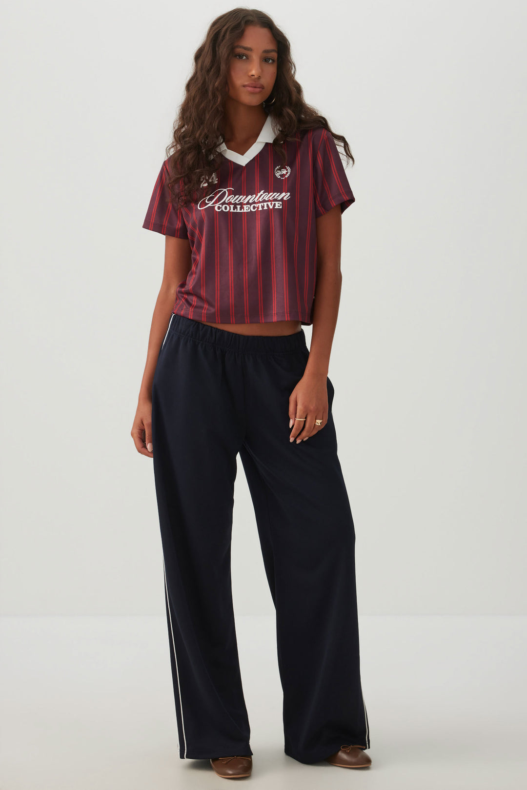 Haut polo rayé en maille filet