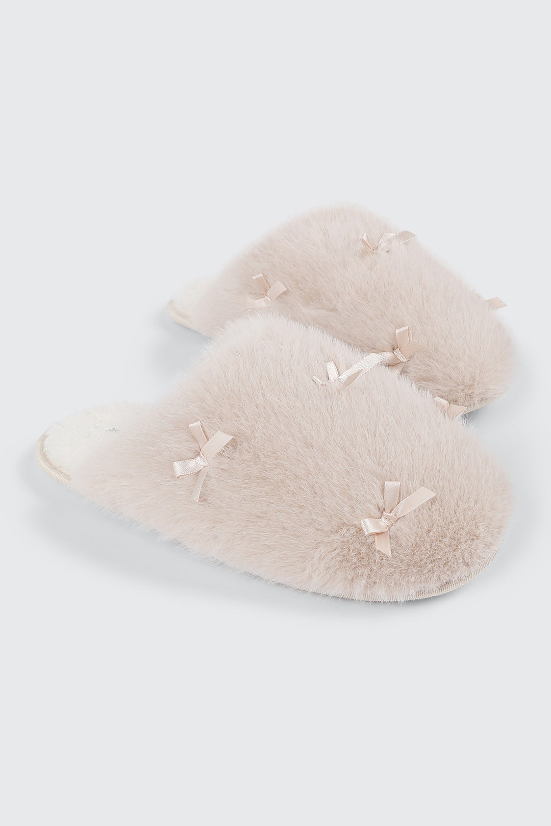 Pantoufles en fausse fourrure à boucles