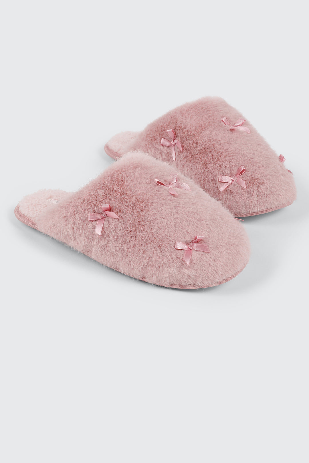 Pantoufles en fausse fourrure à boucles